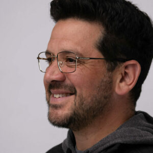 man in glasses smiling