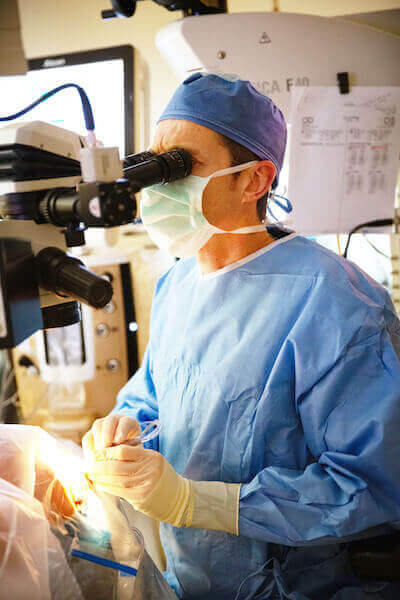 Doctor performing eye surgery