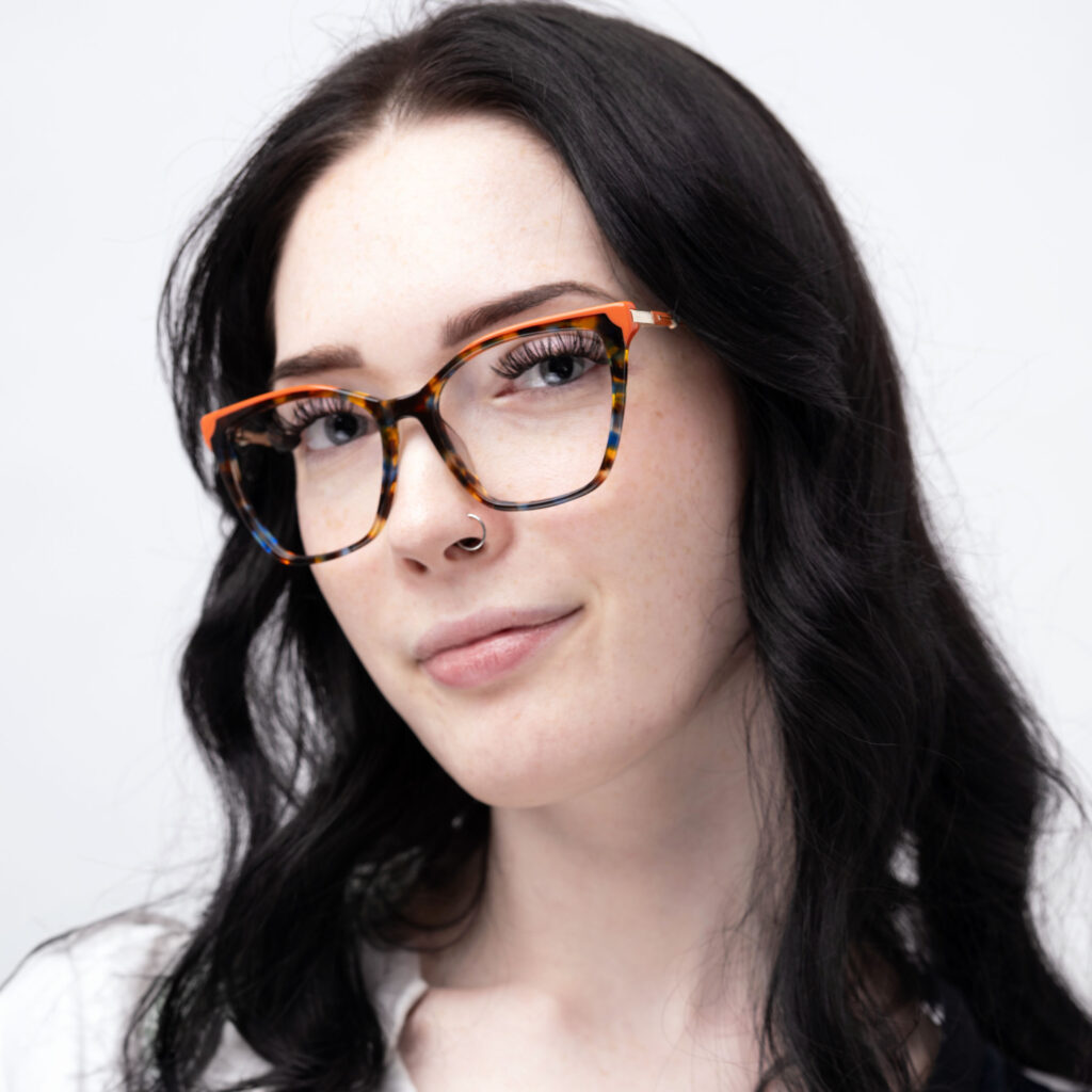 woman in red glasses
