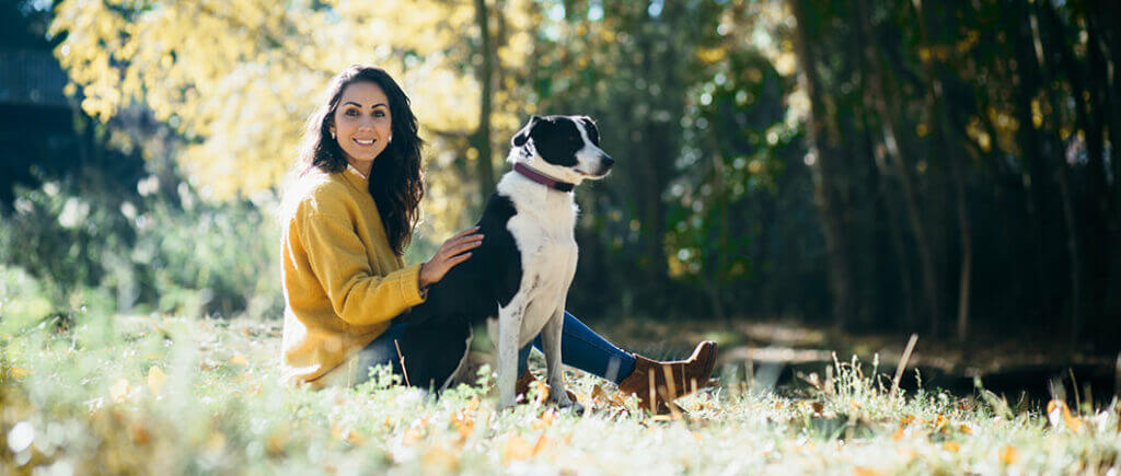 Woman outdoors with dog
